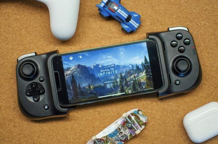 a game controller sitting next to a smart phone